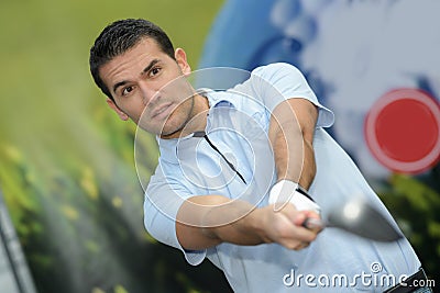 golfer finishing driver swing Stock Photo
