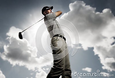 Golfer shooting a golf ball Stock Photo