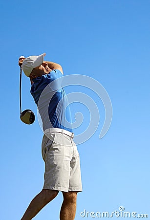 Golfer shooting a golf ball Stock Photo