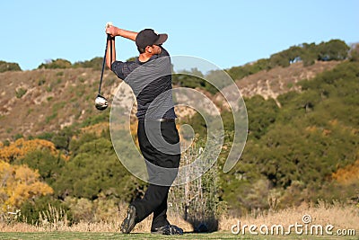 Golfer swing finish Stock Photo