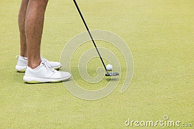 a golfer taking a shot on the green Stock Photo