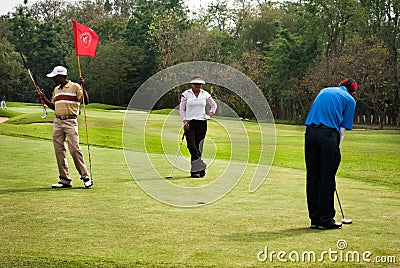 Golfers at practice Editorial Stock Photo