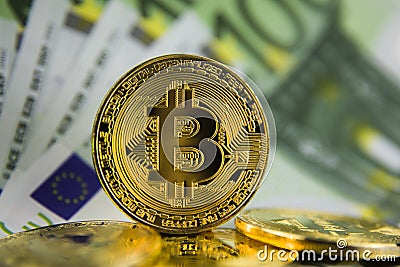 Golg coins bitcoin on euro banknotes Stock Photo