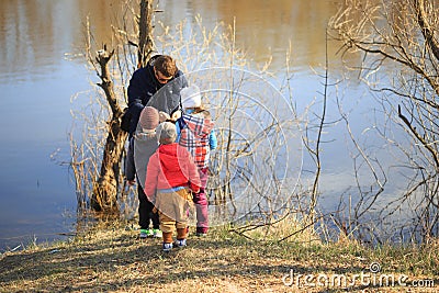 GOMEL, BELARUS - 9 April 2017: The children are watching what the fisherman caught Editorial Stock Photo