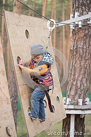 Gomel, Belarus - 30 April, 2017: Rope town for a family holiday in the countryside. Family competition to overcome aerial obstacle Editorial Stock Photo