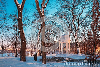 Gomel, Belarus. City Park In Winter Night. Gazebo In Park. Garden Pergola In Snow Stock Photo