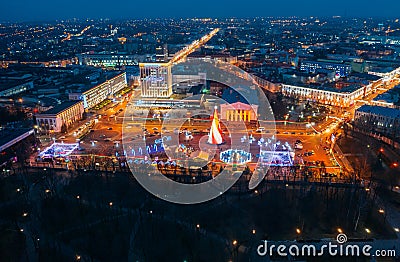 Gomel, Belarus. Main Christmas Tree And Festive Illumination On Lenin Square In Homel. New Year In Belarus. Aerial Night Editorial Stock Photo