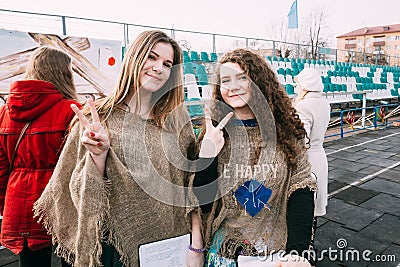 Two beautiful girls participating in the celebration Maslenitsa Shrovetide in Gomel, Belarus. Editorial Stock Photo