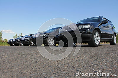 GOMEL, Republic of Belarus, August 29, 2015: wedding cortege of five identical black decorated cars Editorial Stock Photo