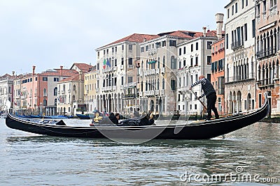 Gondola boat with passengers in Venice, Italy Editorial Stock Photo