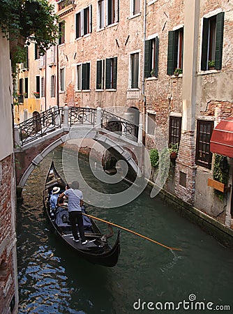 Gondola on narrow canal Stock Photo