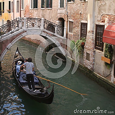 Gondola on narrow canal Stock Photo