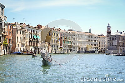 Gondola sails down the channel in Venice Editorial Stock Photo