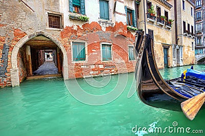 Gondola on small canal in Venice, Italy. Stock Photo