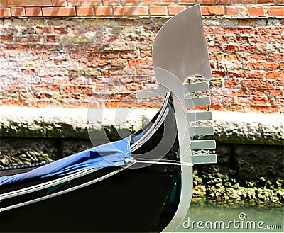 Gondola the typical Venetian boat and the background of bricks Stock Photo