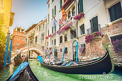 Gondolas on canal in Venice, Italy with retro vintage Instagram Editorial Stock Photo