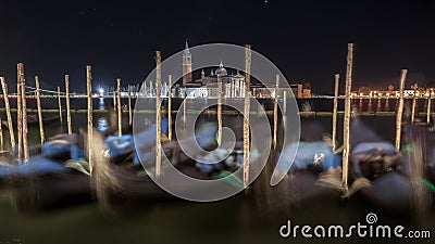 Gondolas, Grand Canal and San Giorgio Maggiore Church at night, Venice Stock Photo