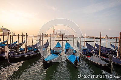 Gondolas of Venice Italy in the morning against the backdrop of sunrise Editorial Stock Photo