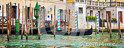 Gondolas and wooden piles on the grand Canal, panorama of Venice Italy Stock Photo