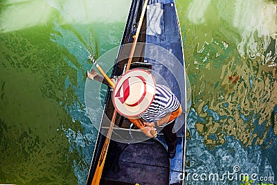 Gondolier in a boat. Top view from the bridge. Editorial Stock Photo