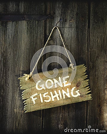 A sign with Gone fishing Stock Photo