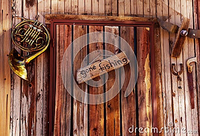 Gone fishing sign on old door Stock Photo