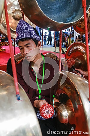A Gong Player or Penabuh Gong Editorial Stock Photo