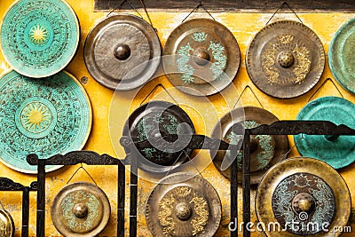 Gong - traditional Asian musical instruments on a street market. Stock Photo