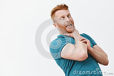 It is gonna chuckle me. Portrait of funny carefree and playful redhead guy with bristle, bending backwards while holding Stock Photo