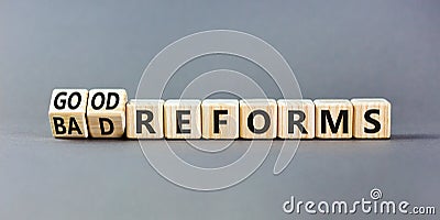 Good or bad reforms symbol. Concept words Good reforms Bad reforms on beautiful wooden blocks. Beautiful grey table grey Stock Photo