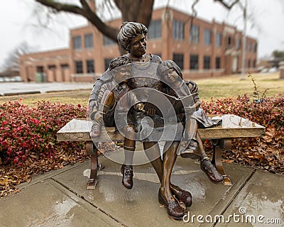 `The Good Book`, a bronze sculpture by Mark Ludeen in Edmond, Oklahoma. Editorial Stock Photo