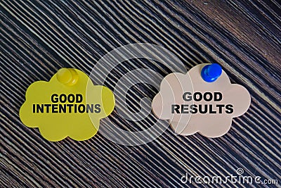 Good Intentions or Good Results write on sticky notes isolated on Wooden Table Stock Photo