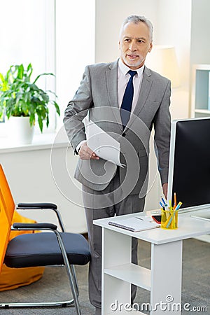 Good-looking bearded office worker being busy at work Stock Photo