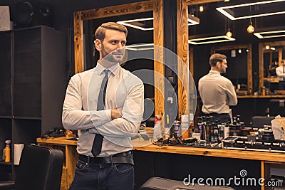 Good-looking confident businessman in a barbershop Stock Photo