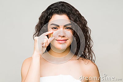 Female model holding a collagen in front of her face Stock Photo