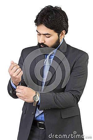 Good looking mature Asian Indian male with business suit isolated on white background Stock Photo