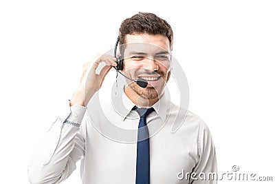 Sales rep smiling over a phone call Stock Photo