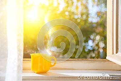 Good morning! Cup on the window with sun Stock Photo