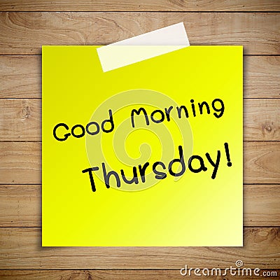 Good morning thursday on sticky paper on Brown wood plank wall t Stock Photo