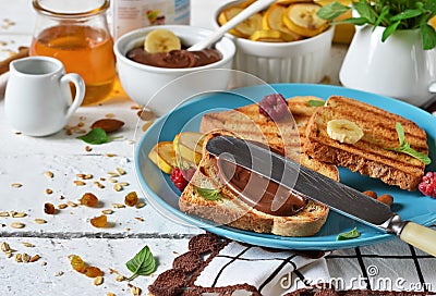 Good morning - toast with walnut, chocolate paste, banana and ho Stock Photo