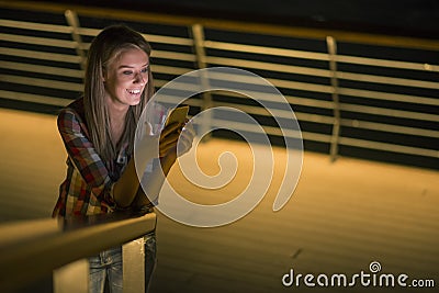 Good news. Beautiful young girl checks something on her smart phone Stock Photo