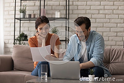 Happy married couple manage family business accounting at home office Stock Photo
