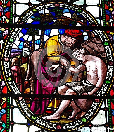 The Good Samaritan in stained glass Stock Photo