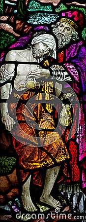 The Good Samaritan in stained glass Stock Photo