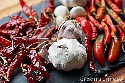 The good stuff. dried and fresh chillies with cloves of garlic. Stock Photo