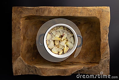 Breakfast on a wooden rectangular bowl with a black and white pot. Stock Photo