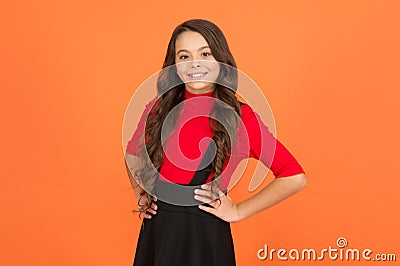 Good vibes. Happy childhood. Healthy smile. Feeling lucky. Perfect girl. Positive emotions. Teen girl smiling orange Stock Photo