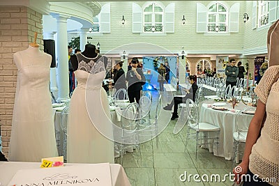 A hall of wedding exhibition and two wedding dresses Editorial Stock Photo