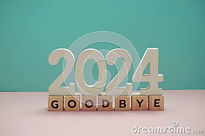 Goodbye 2024 alphabet letter on blue and pink background Stock Photo