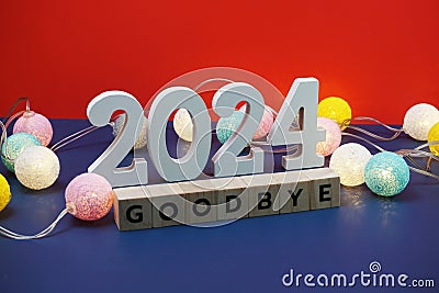 Goodbye 2024 word alphabet letters on red and blue background Stock Photo